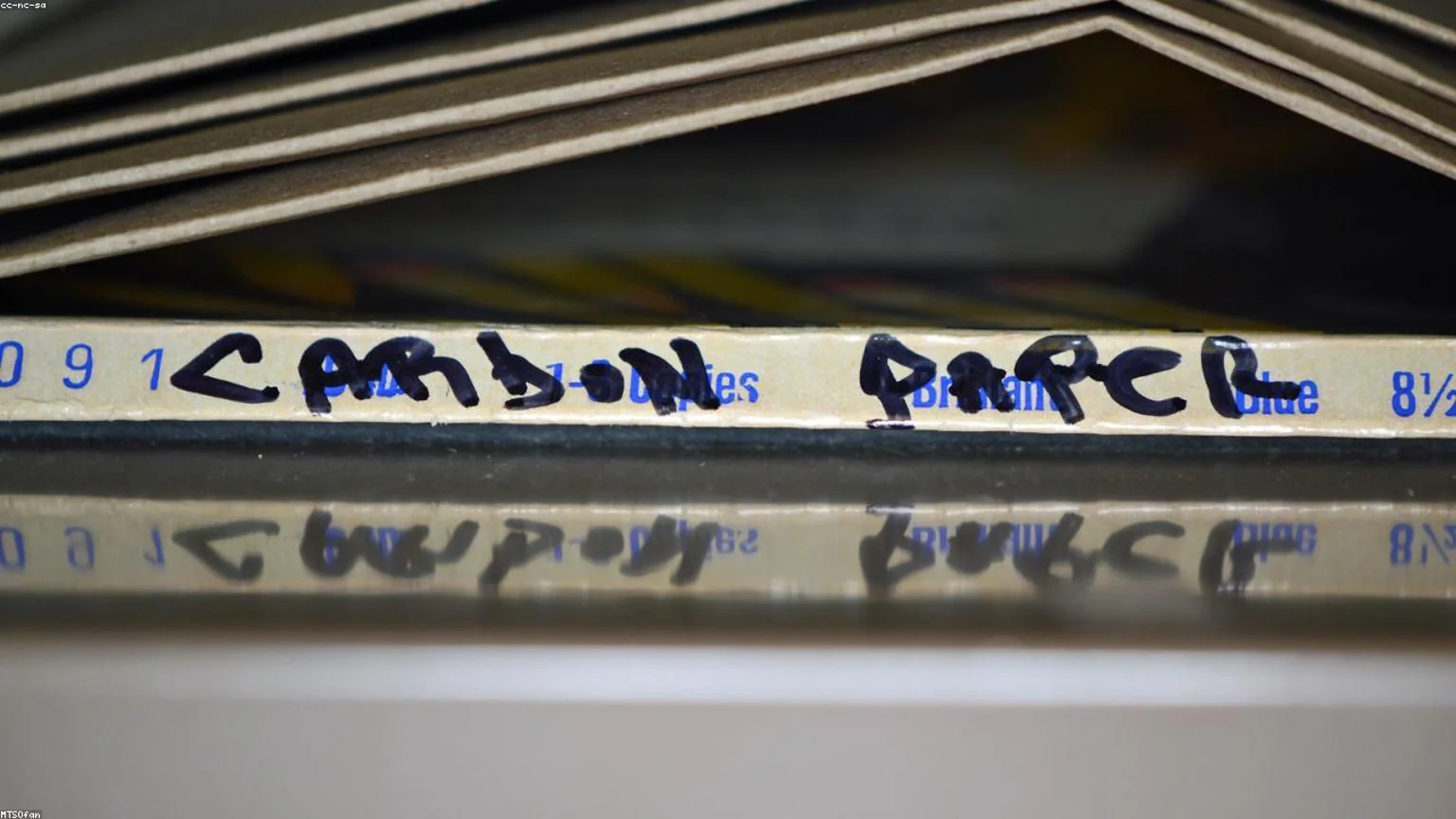 office label maker, folders, and organized supply bins